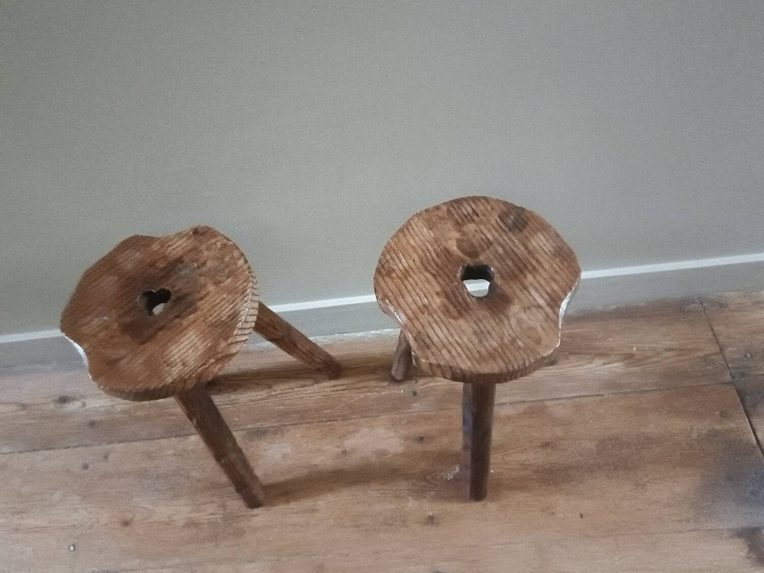 A pair of tripod stools