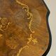 Two-tone black and mahogany pedestal table with mahogany veneer