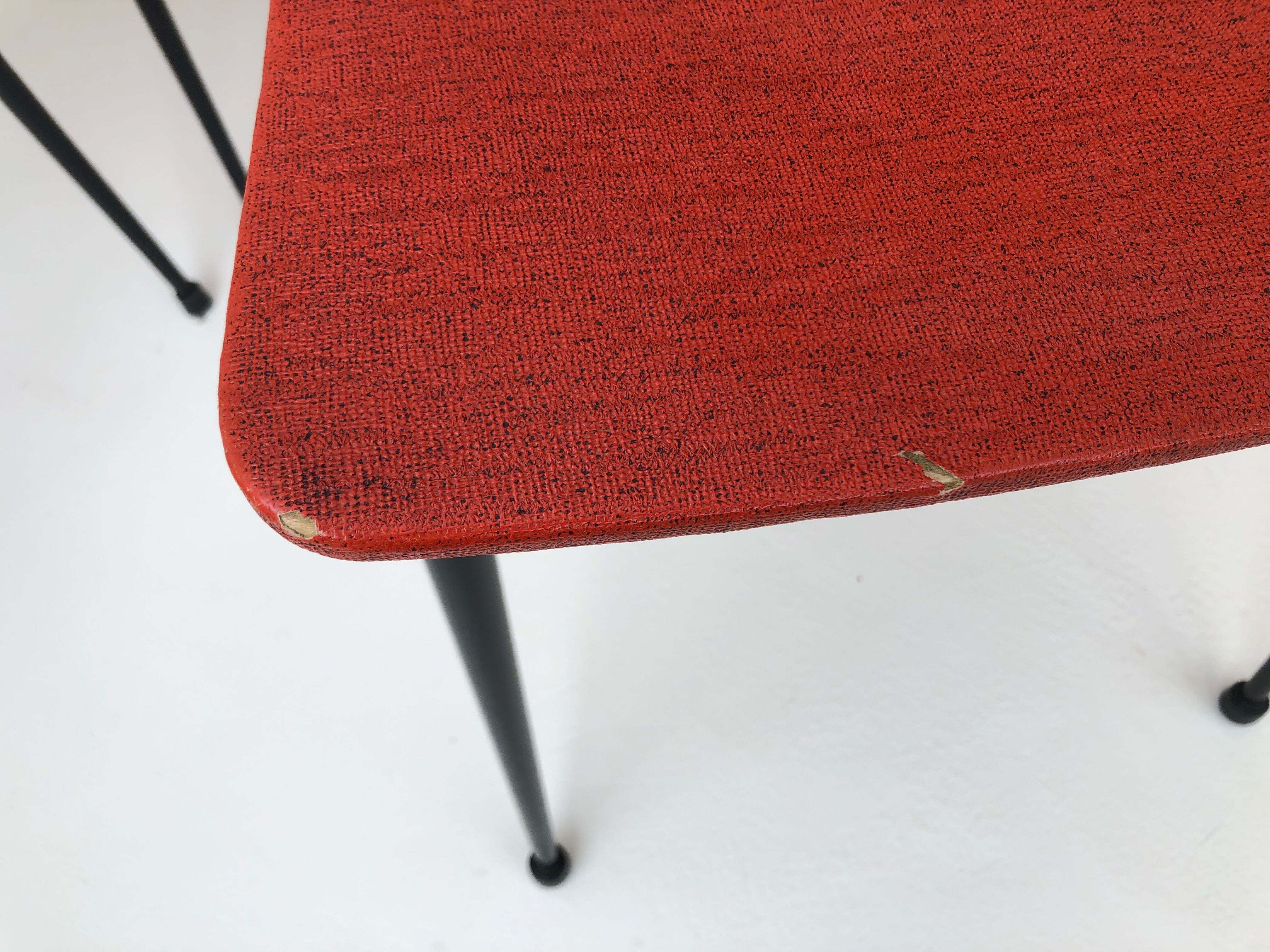 Red metal chairs from the 60s