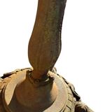 Antique cast iron garden table with decorative openwork top.