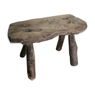 Farm stool made of raw wood