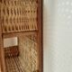 Rattan and wicker wall shelf