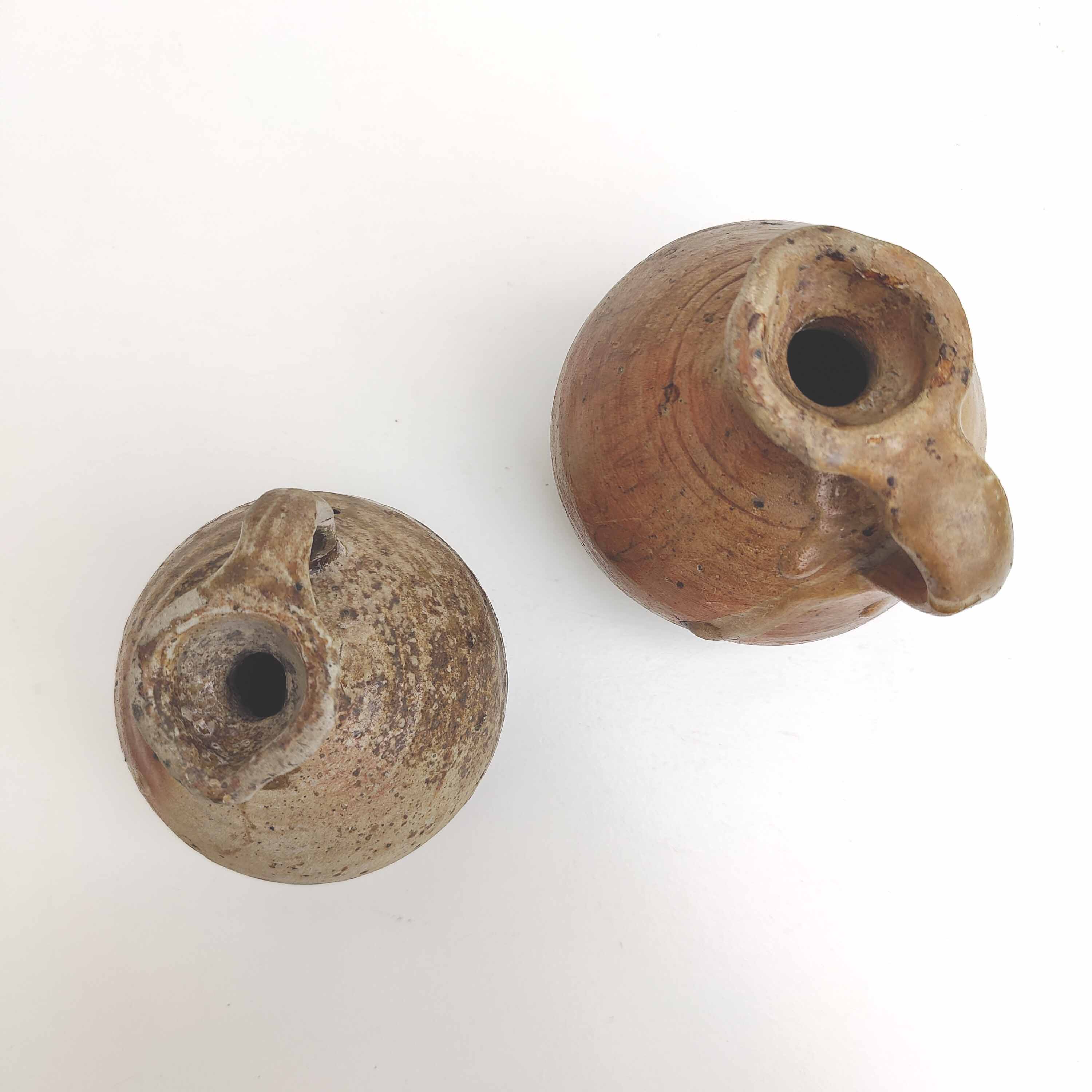 Set of two small sandstone pitchers