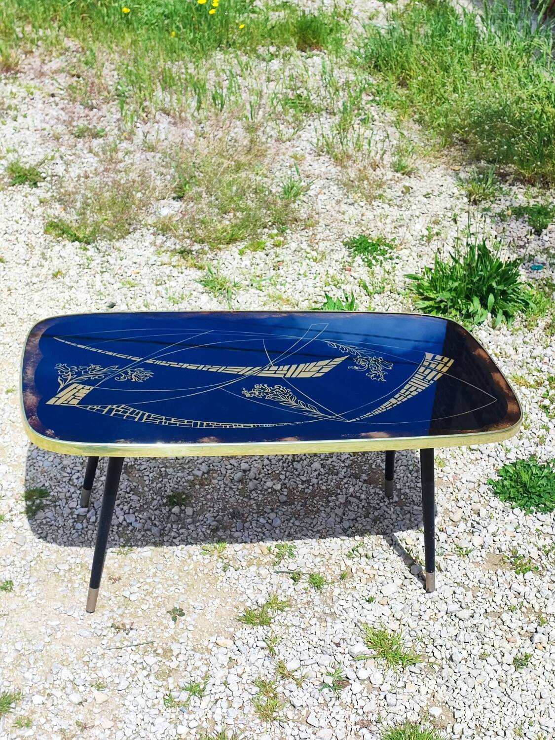 Vintage coffee table with compass legs