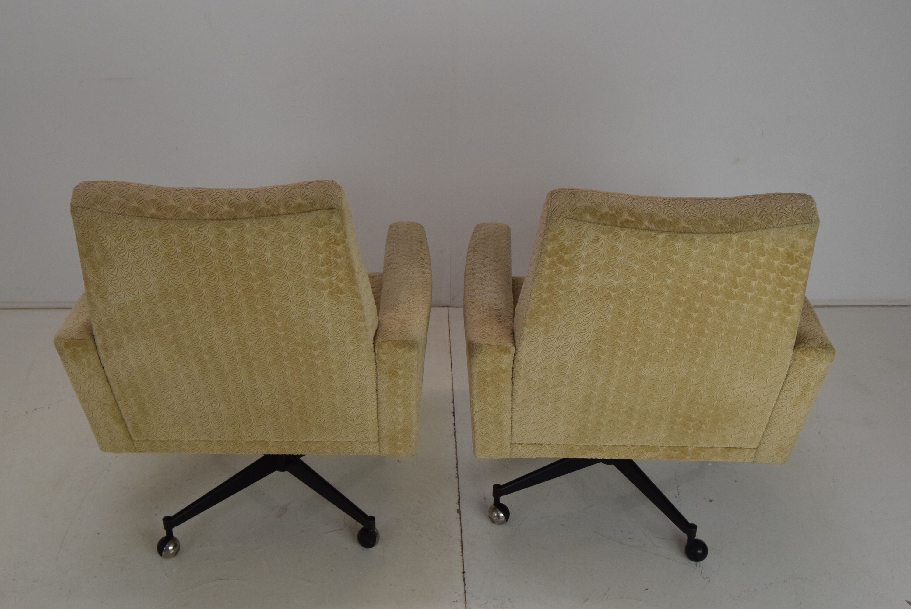 Pair of mid-century swivel armchairs with wheels 1970's