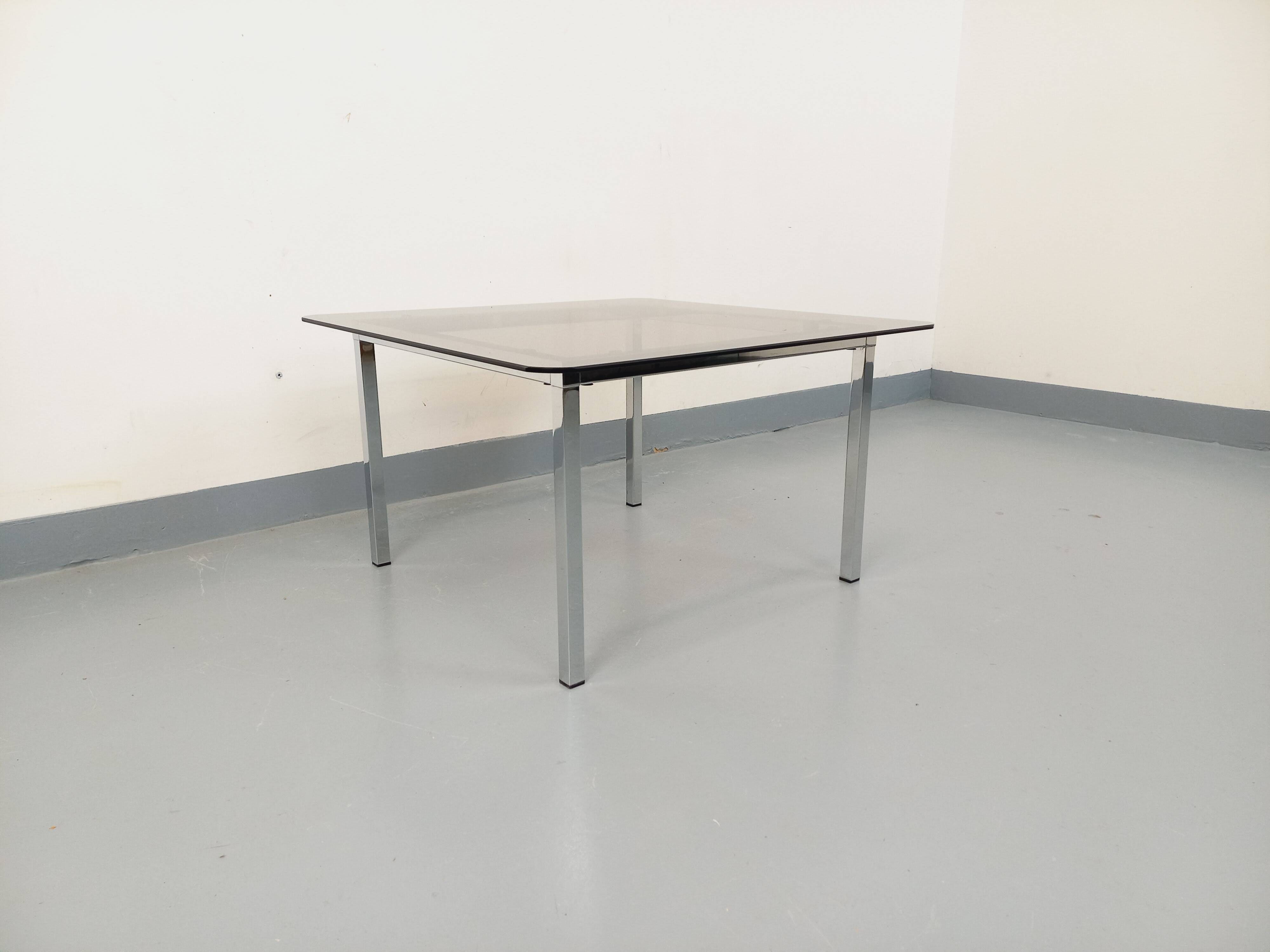 Vintage square coffee table in smoked glass and chrome metal from the 1970s.