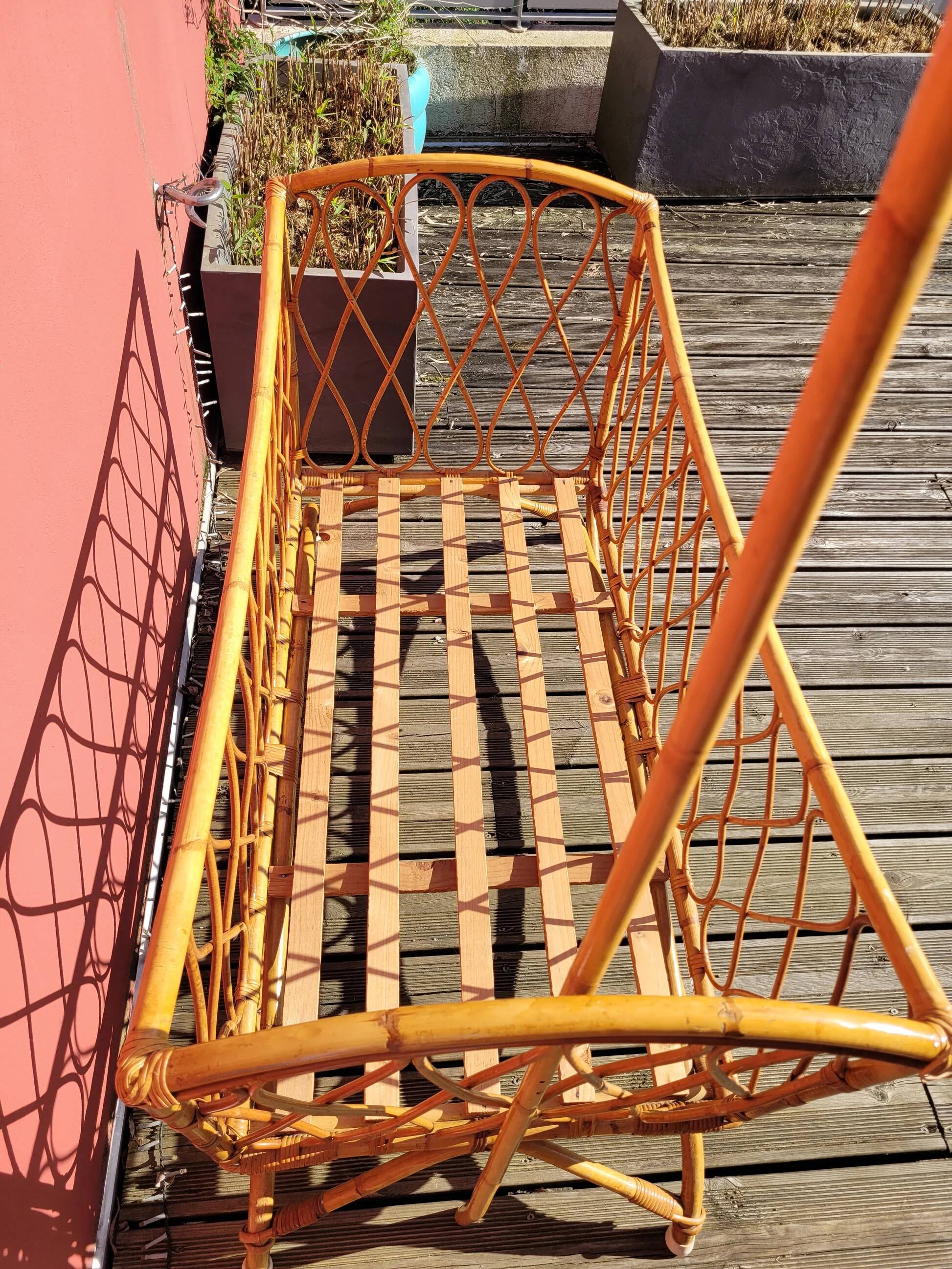 Bamboo and rattan baby cot with canopy.