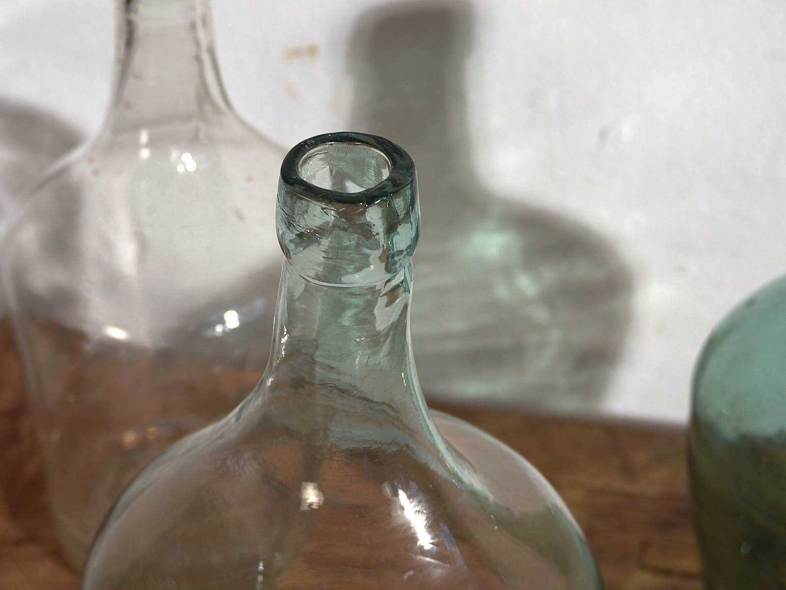 Antique colored demijohns (c.1920). Set of 3 pieces