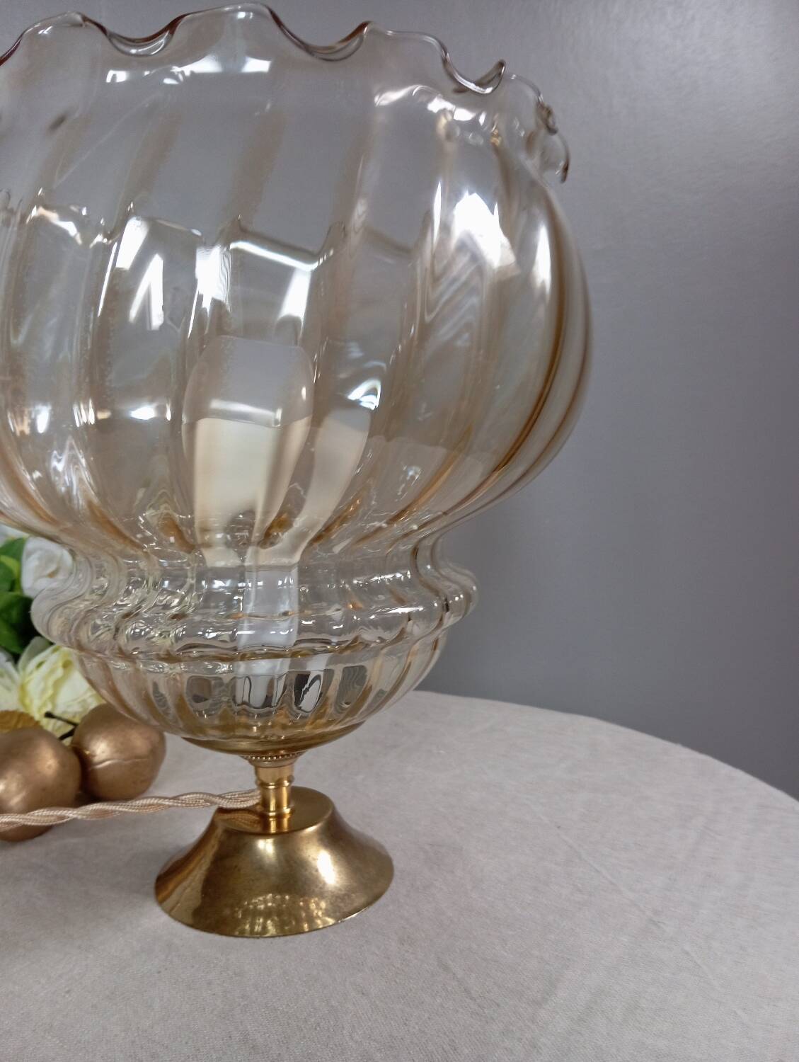 Table lamp with gold metal base, vintage amber globe