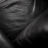 Mid-century danish modern minimalist black leather swivel armchair by georg thams, 1960s