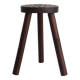 Tripod stool carved with an adze — France, 20th century