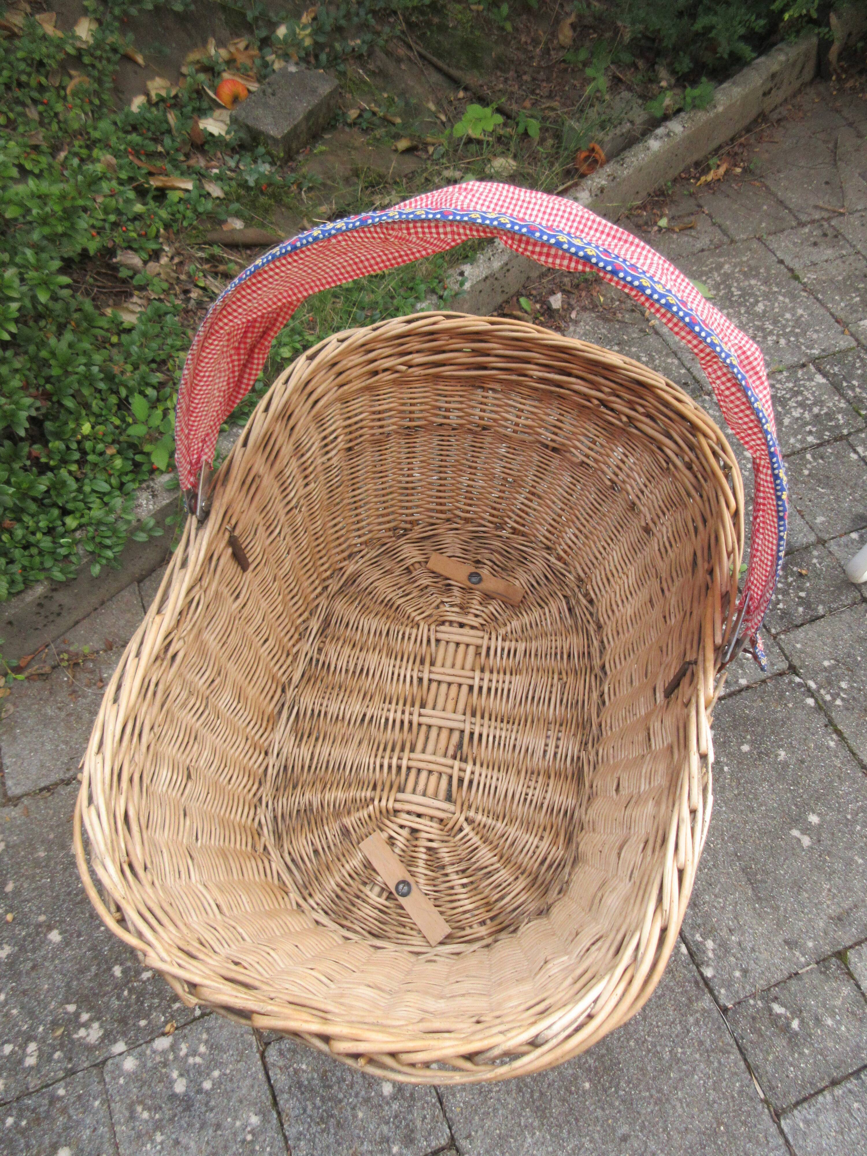 Doll cradle on wicker wheels