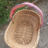 Doll cradle on wicker wheels
