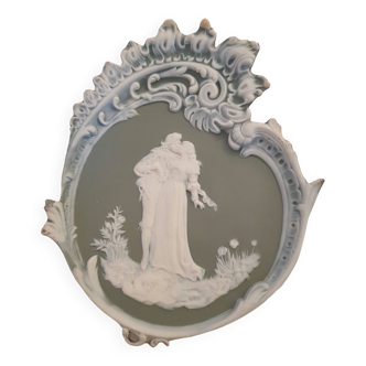 Wall plaque, Wedgwood cameo style bisque porcelain medallion, romantic scene, on green background