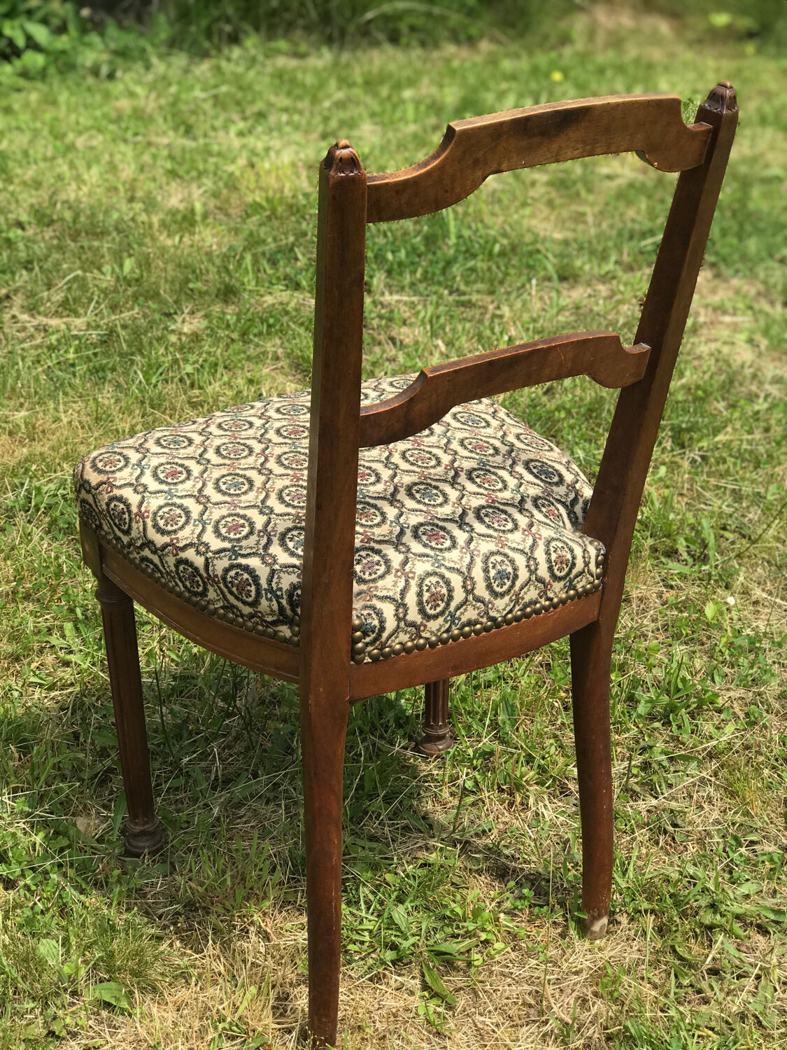 Antique chair seat upholsterer medallions