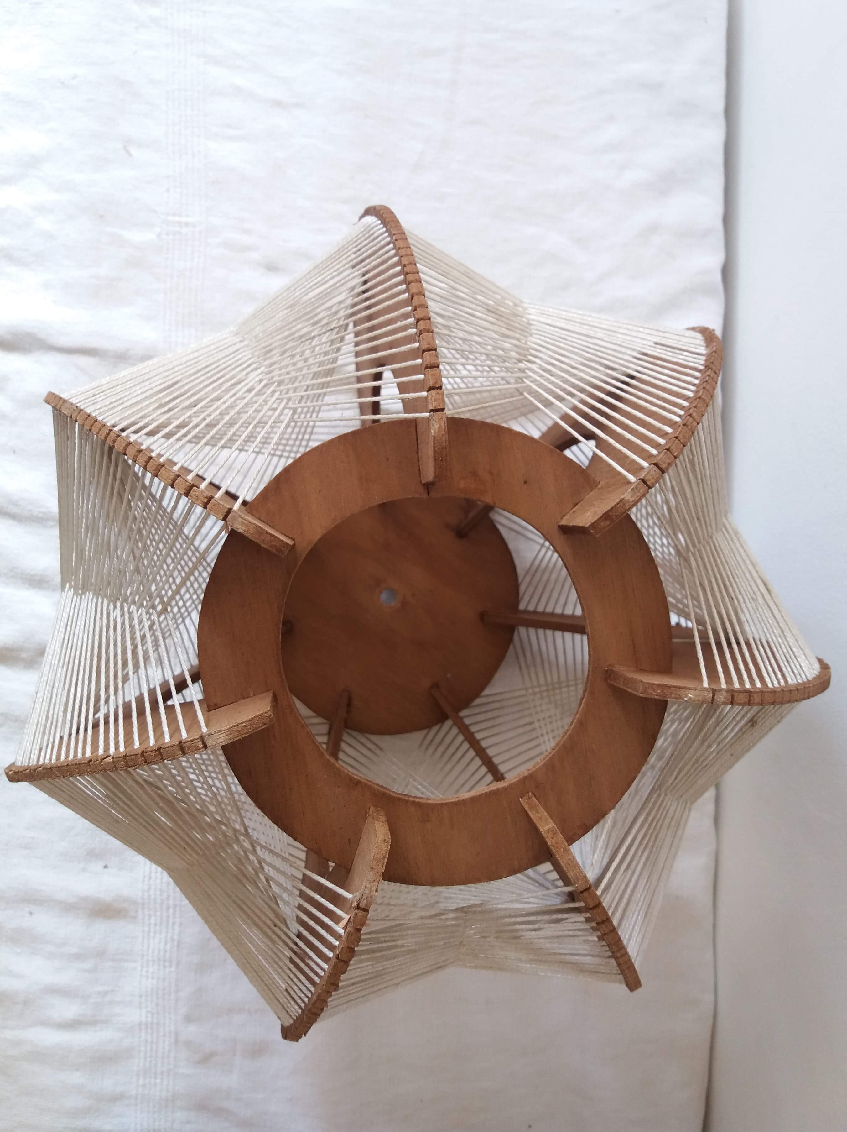 Scandinavian hanging lamp in wood and stretched wires