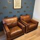Ensemble de deux fauteuils en cuir de buffle.