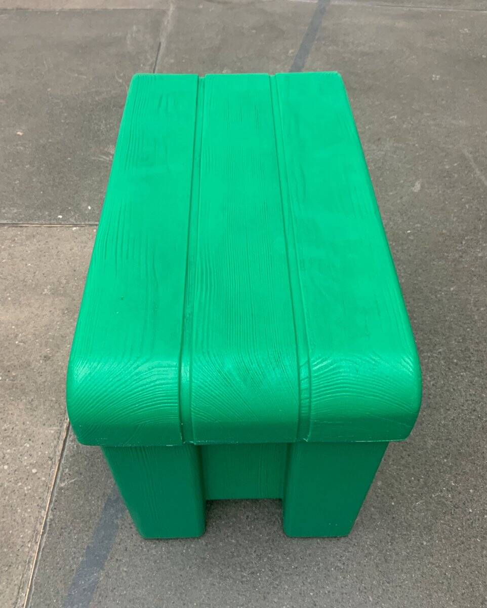 Postmodern plastic stool with a wood effect.