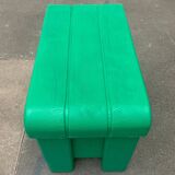 Postmodern plastic stool with a wood effect.