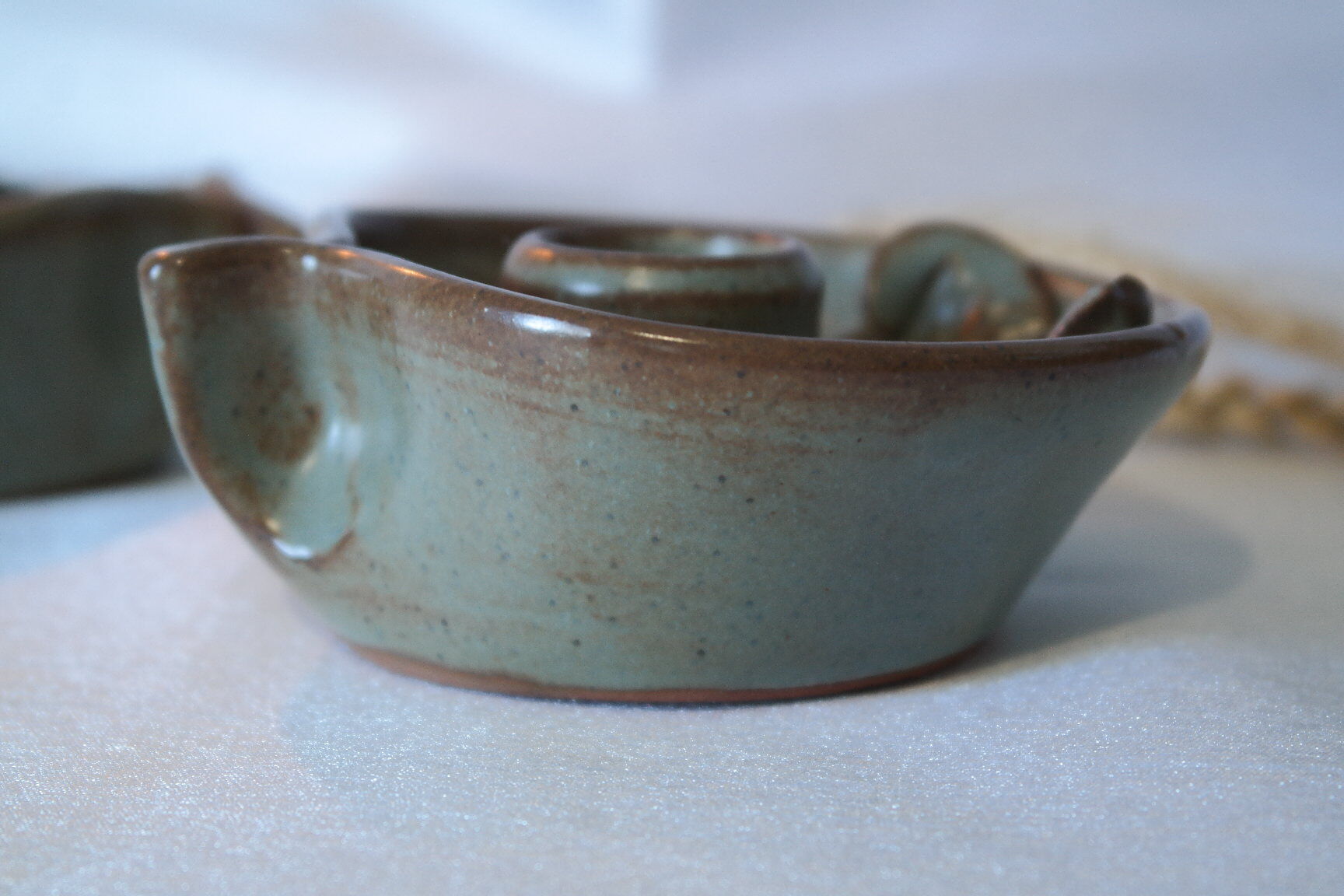 Pair of cellar rat candle holders in glazed sandstone