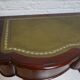 Mahogany and green leather console, 1860-70