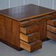 Antique Victorian oak kneehole desk with 18 double-sided drawers.