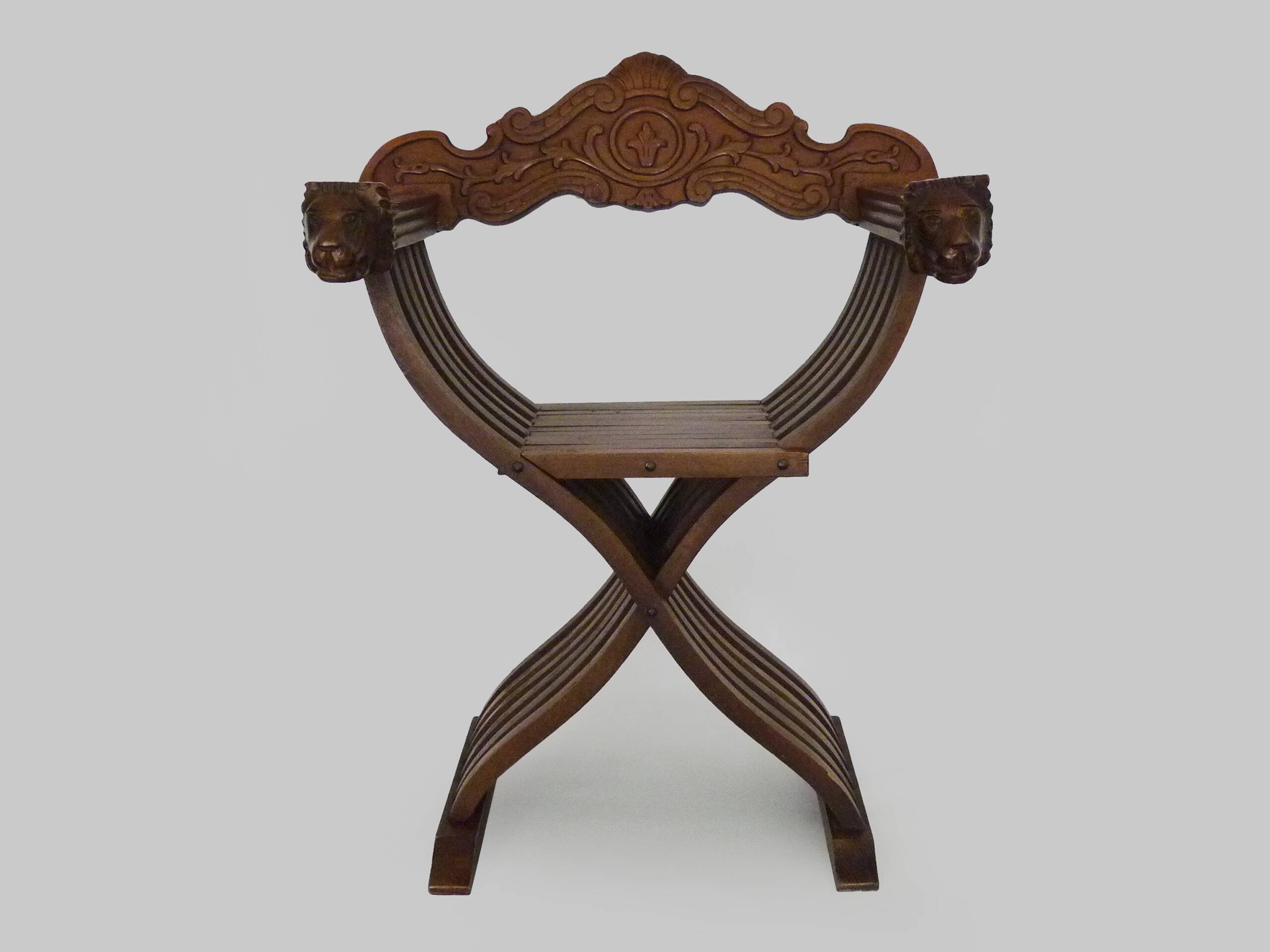 Vintage Savonarola chair with lion head, wood, Italy, 1950s