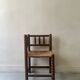 Corner straw chair "fireplace corner" in turned and beaded wood