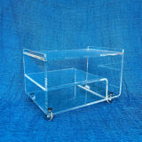 Translucent plexiglass storage drawer/cabinet on wheels.