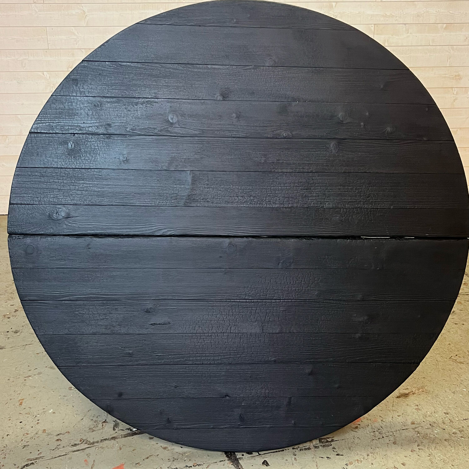 Brutalist round table in burnt wood yakisugi