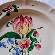 Earthenware plate from St Clément with tulip decoration.