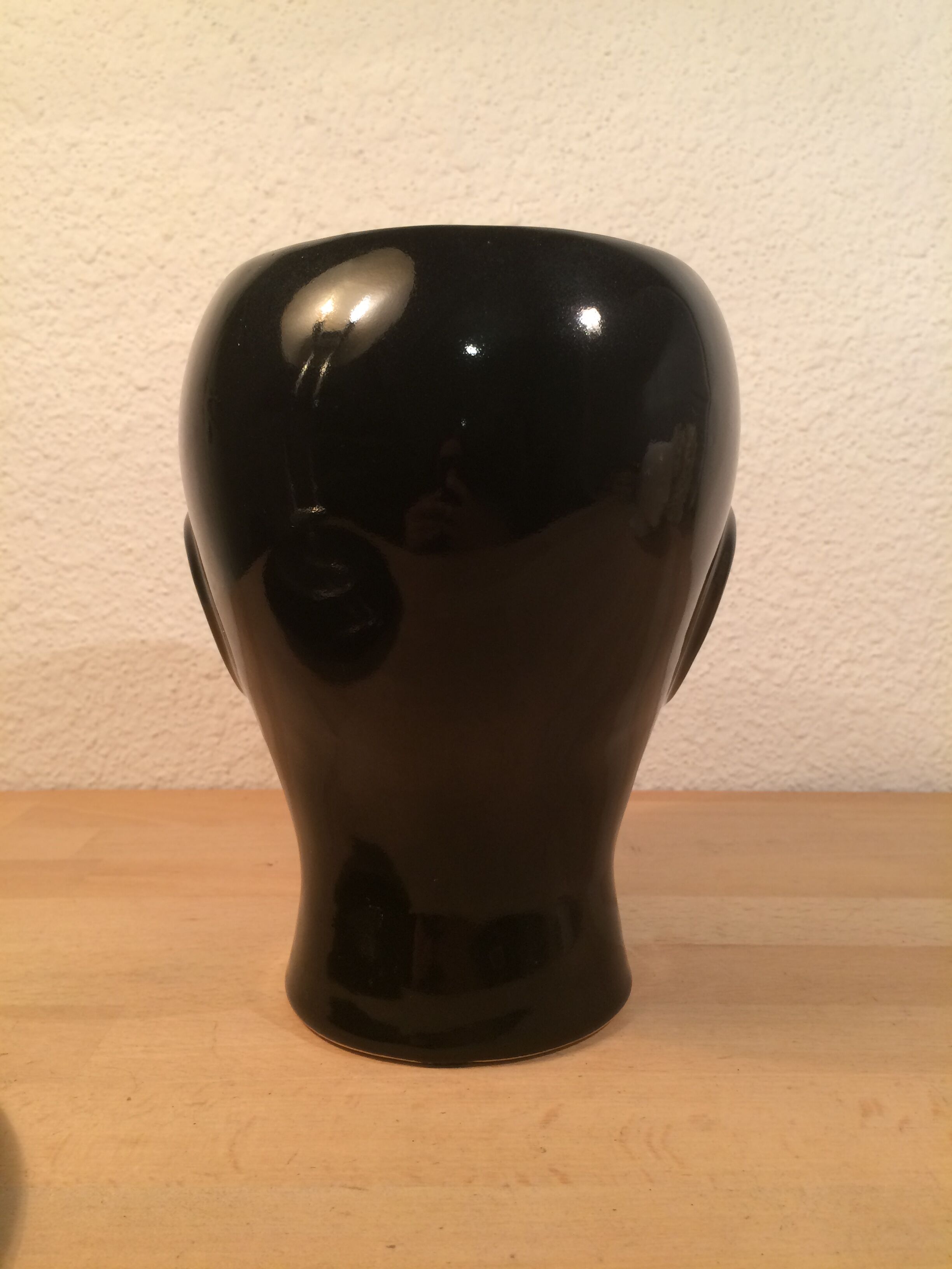 2 black and white ceramic head vases, face
