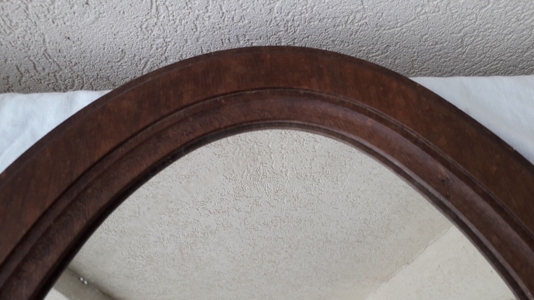 Oval wooden mirror