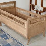 Children's bed in wood and sandblasted rattan from the 1960s.