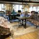 Set of two toad-shaped sofas covered in floral fabric.
