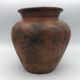 Vase or pot in brown terracotta with artistic decoration of fish.