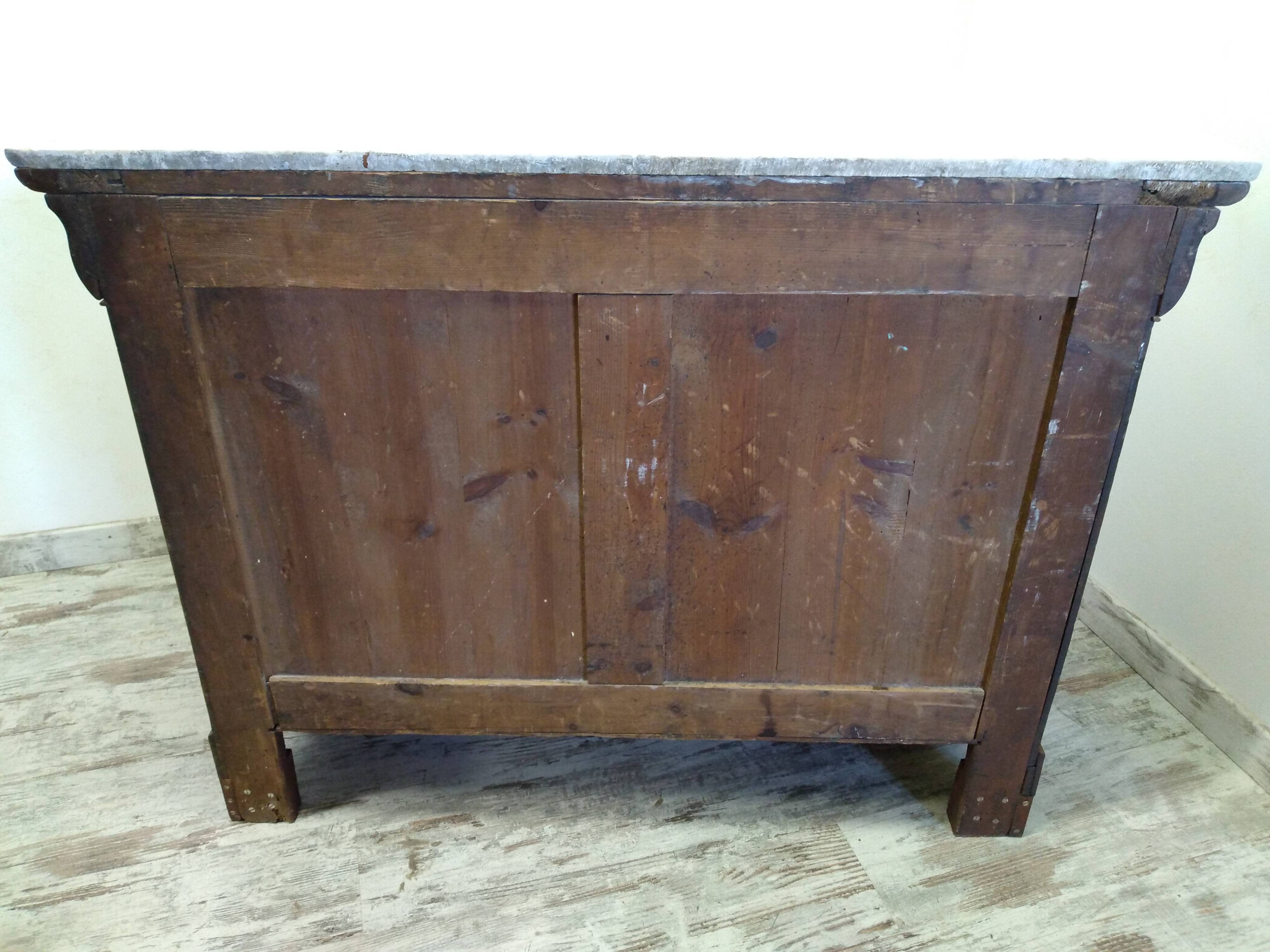 Old chest of drawers with marble