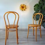 Pair of 1970s bistro chairs in bentwood and caning.
