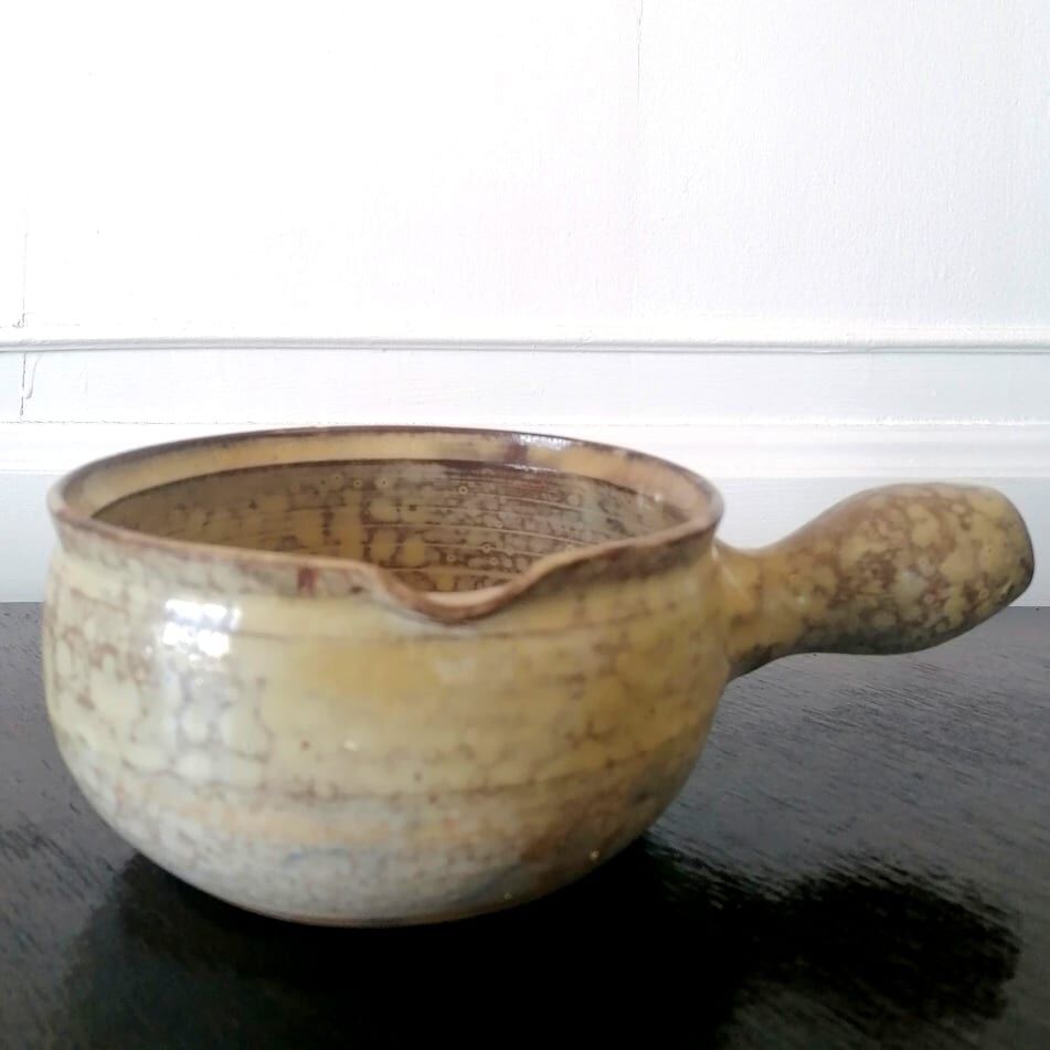 Beige glazed terracotta caquelon