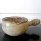 Beige glazed terracotta caquelon