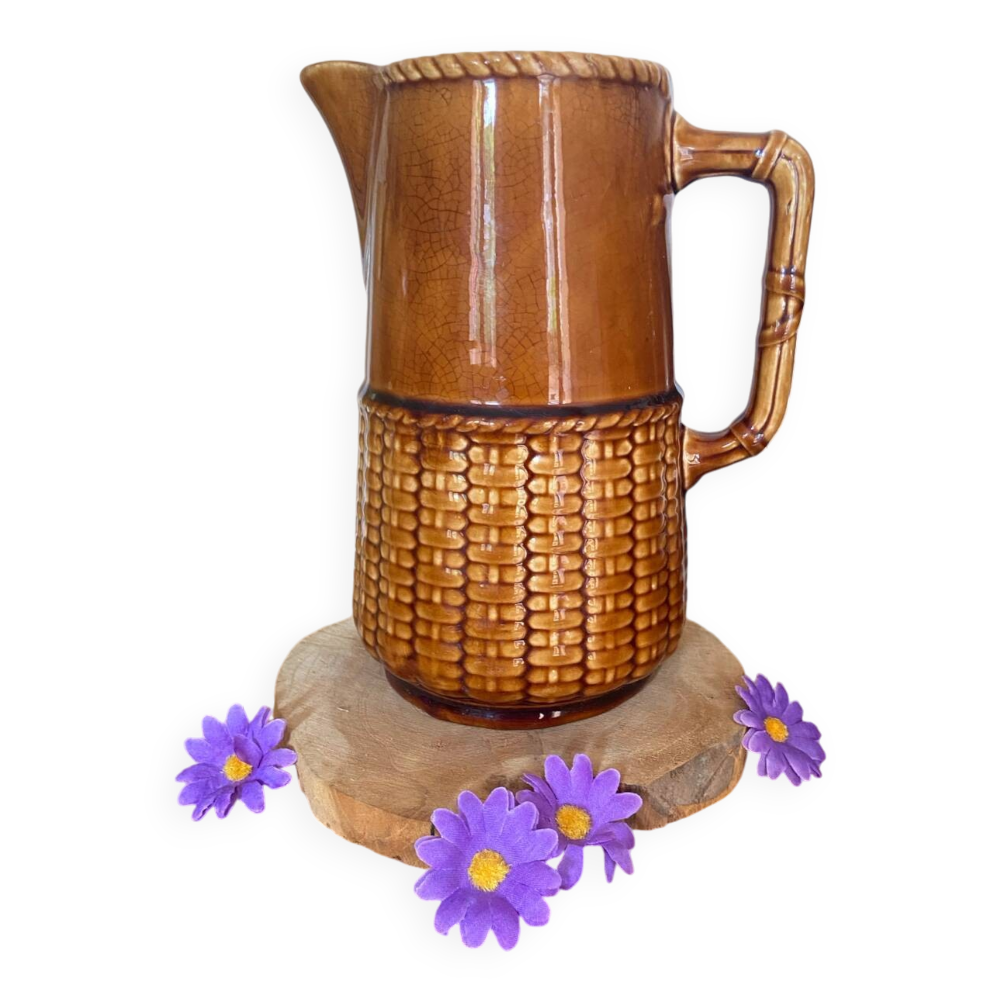 Antique vintage ceramic pitcher or jug from Sarreguemines, France. Brown with a pink interior, imitation basket.