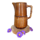 Antique vintage ceramic pitcher or jug from Sarreguemines, France. Brown with a pink interior, imitation basket.