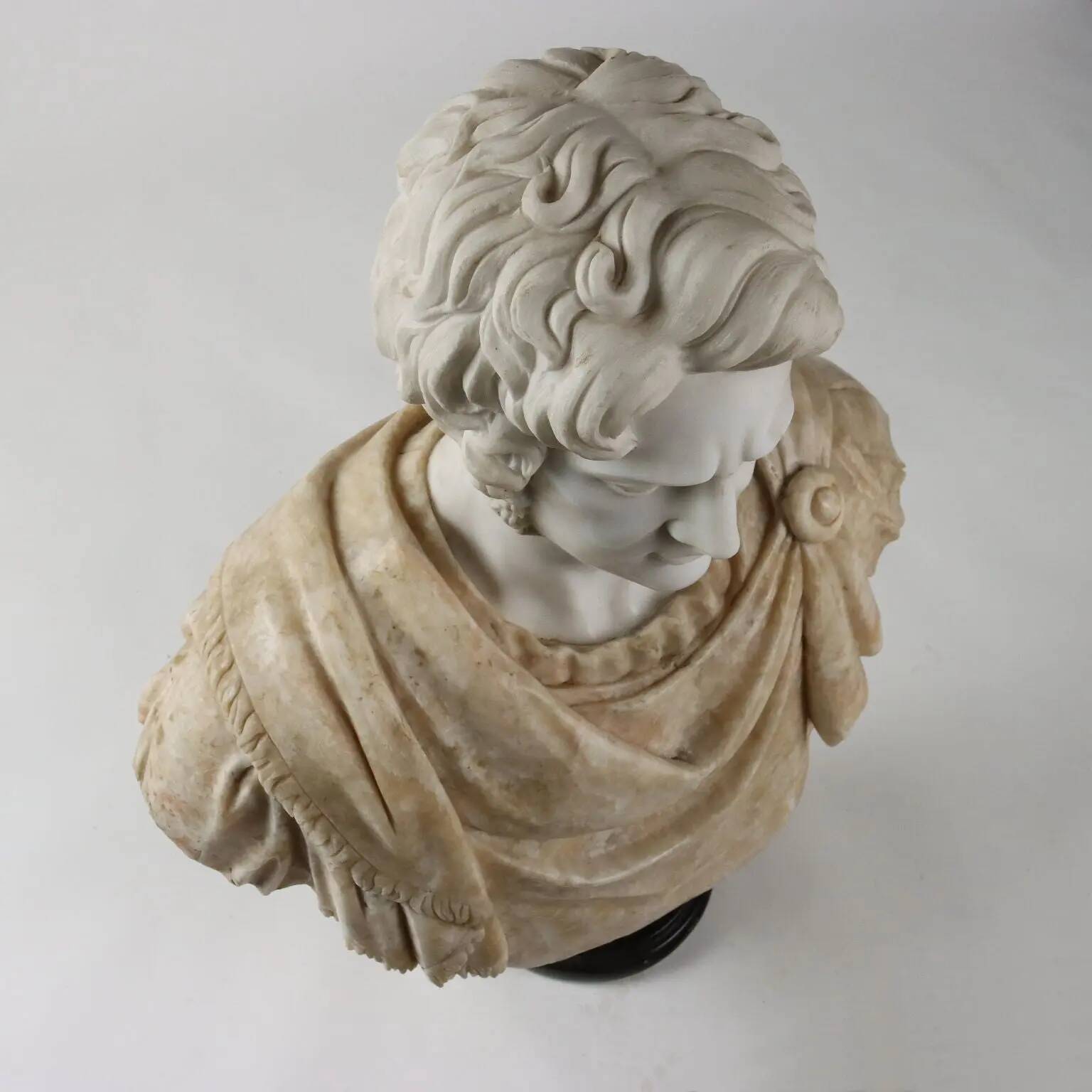 Bust of a Roman emperor in white marble, Italy, 20th century.