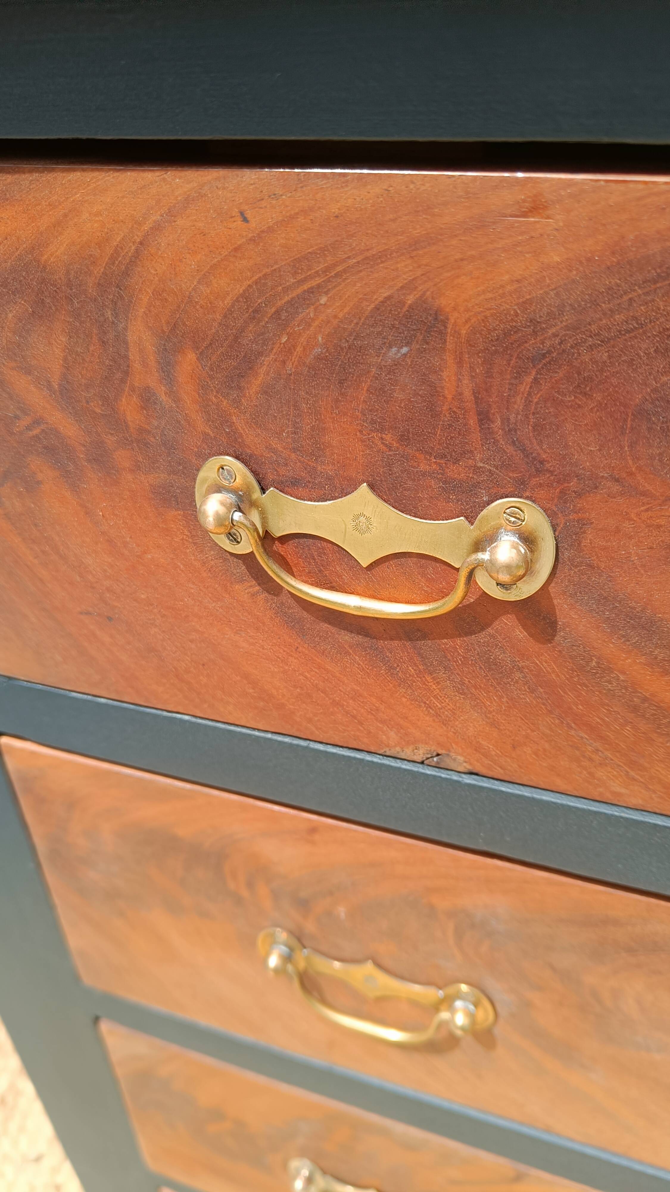Vintage commode revamped in matte black & wood with warm tones.