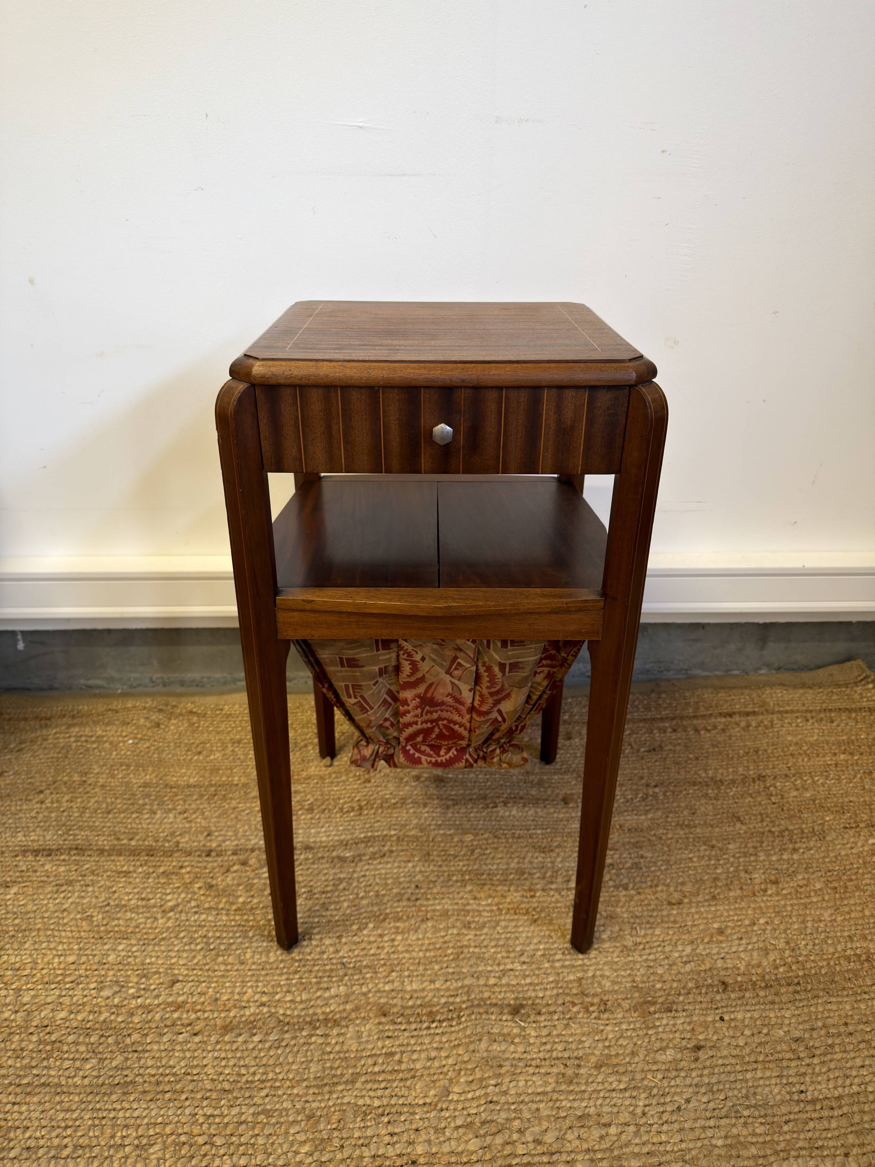 Art Deco sewing table in walnut with a foldable shelf.