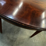Extendable mahogany round table in Louis XVI style