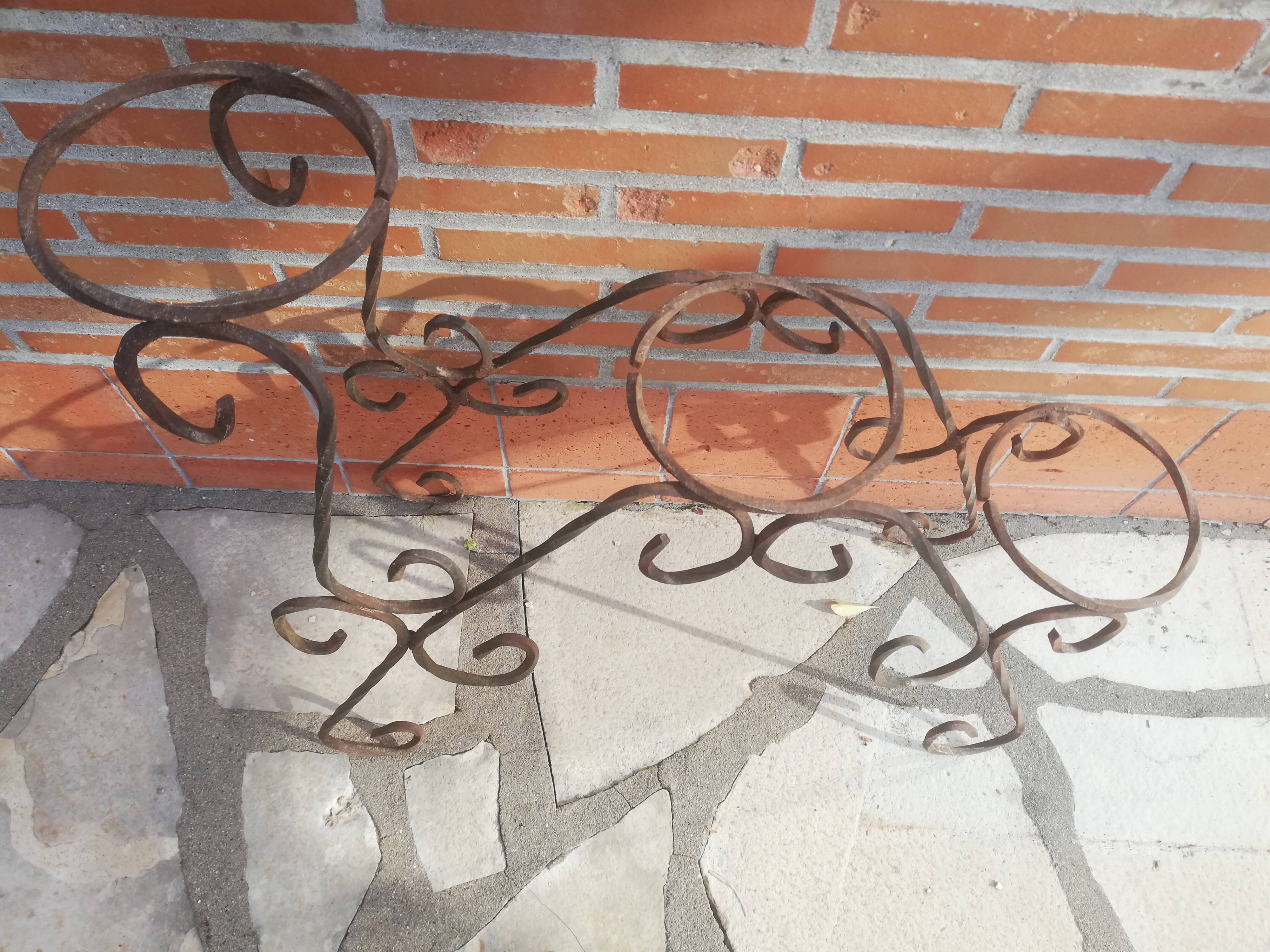 Wrought iron plant holders