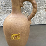 Pitcher with sandstone cap