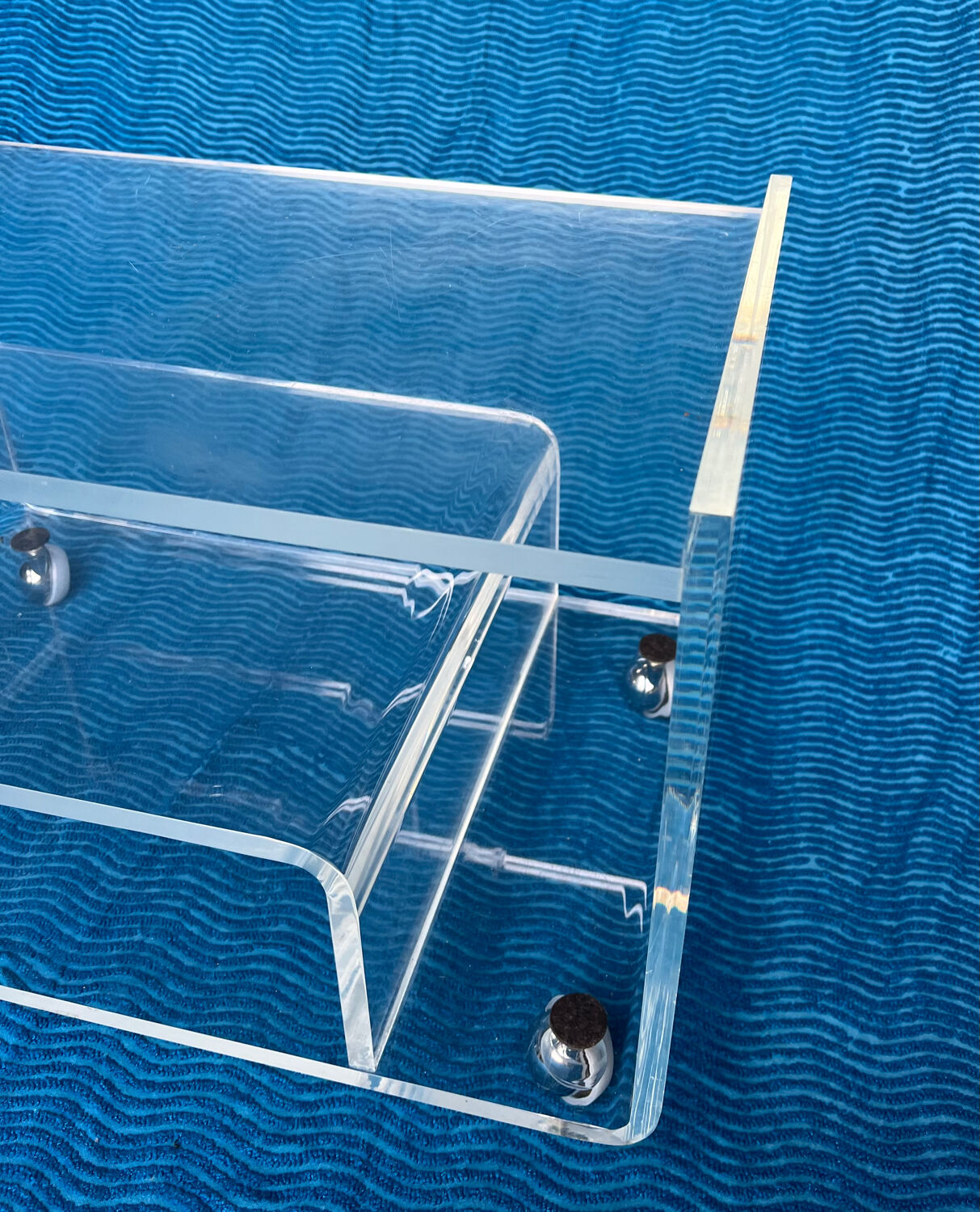 Translucent plexiglass storage drawer/cabinet on wheels.