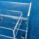 Translucent plexiglass storage drawer/cabinet on wheels.